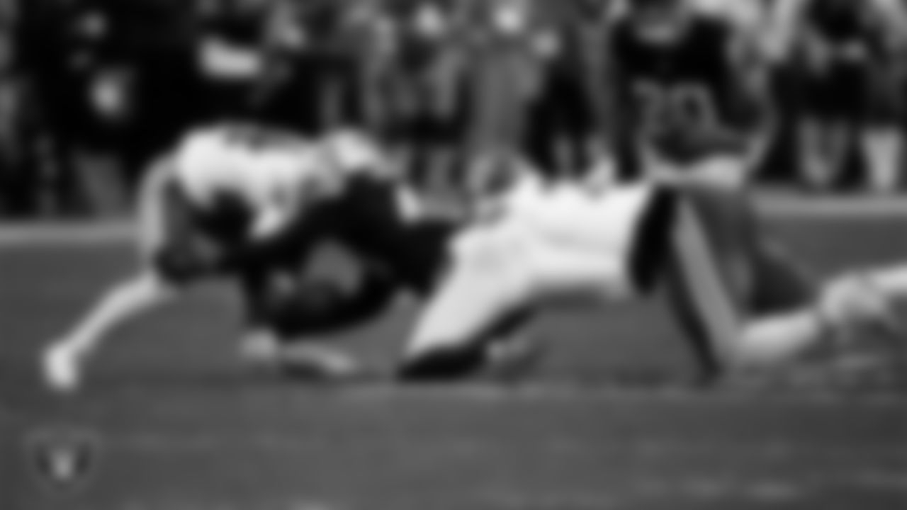Las Vegas Raiders defensive end Charles Snowden (49) attempts to recover a fumble during the regular season home game against the Kansas City Chiefs at Allegiant Stadium.