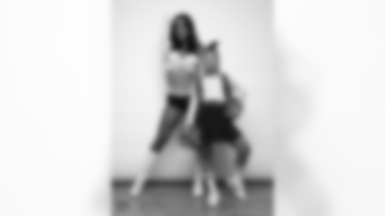 Raiderette Reagan poses for a photo with a Junior Raiderette during 2025 Media Day at The Studio.