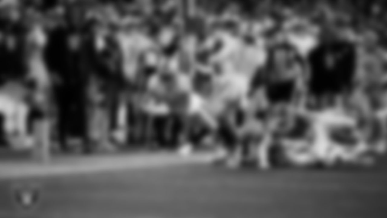 Las Vegas Raiders running back Raheem Mostert (31) goes for a first down during the regular season away game against the Denver Broncos at Empower Field at Mile High.