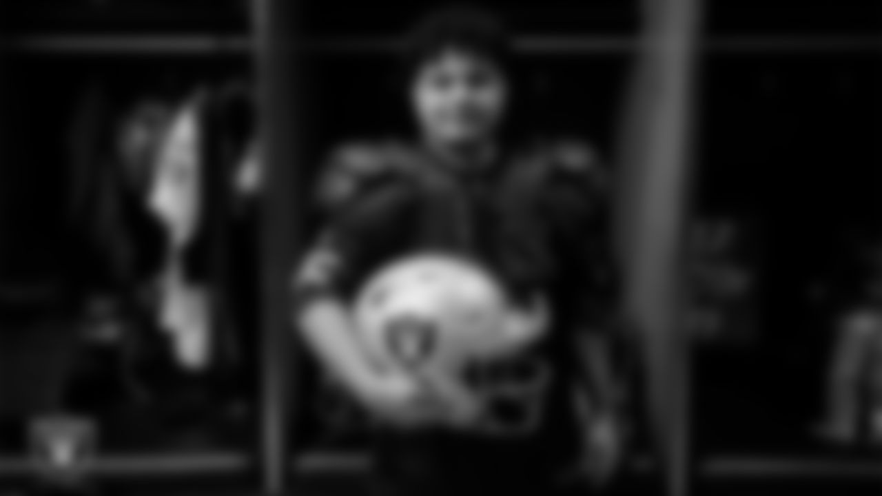 Marcos Carrillo from Make-A-Wish poses for a photo in the locker room during a visit to Intermountain Health Performance Center.