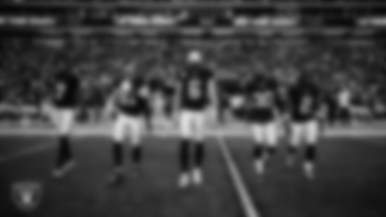 The Las Vegas Raiders walk out to the center of the field for the coin toss before the regular season home game against the the New York Giants at Allegiant Stadium.