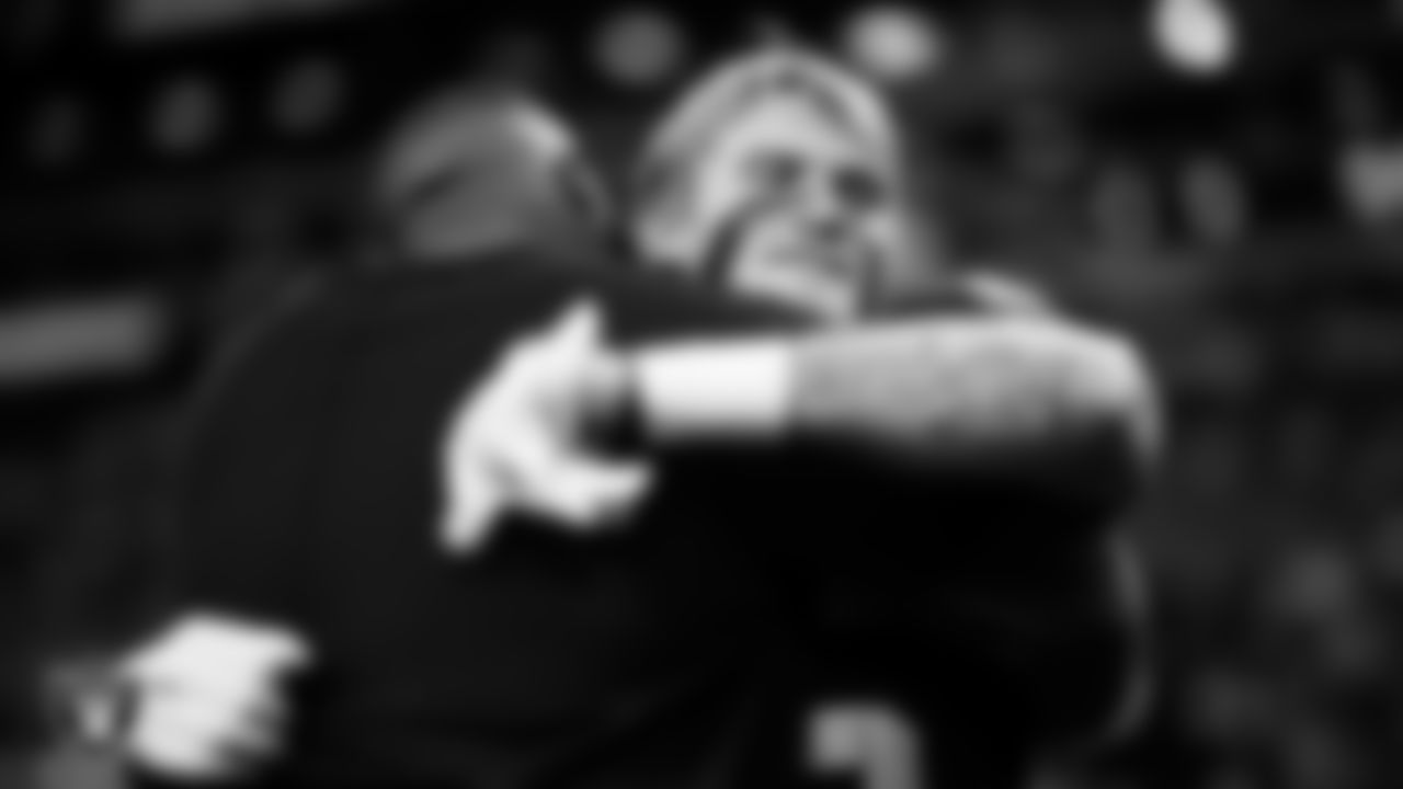 Las Vegas Raiders assistant defensive line coach Kenyon Jackson and linebacker Cody Lindenberg (55) before the regular season home game against the New York Giants at Allegiant Stadium.