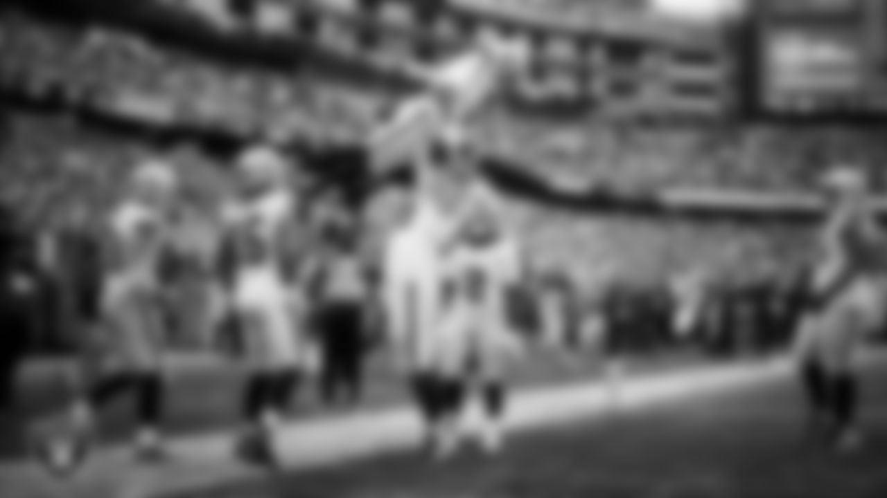 Las Vegas Raiders wide receiver Tre Tucker (1) celebrates with center Jackson Powers-Johnson (58) after making a 26-yard touchdown catch during the regular season away game against the New England Patriots at Gillette Stadium.