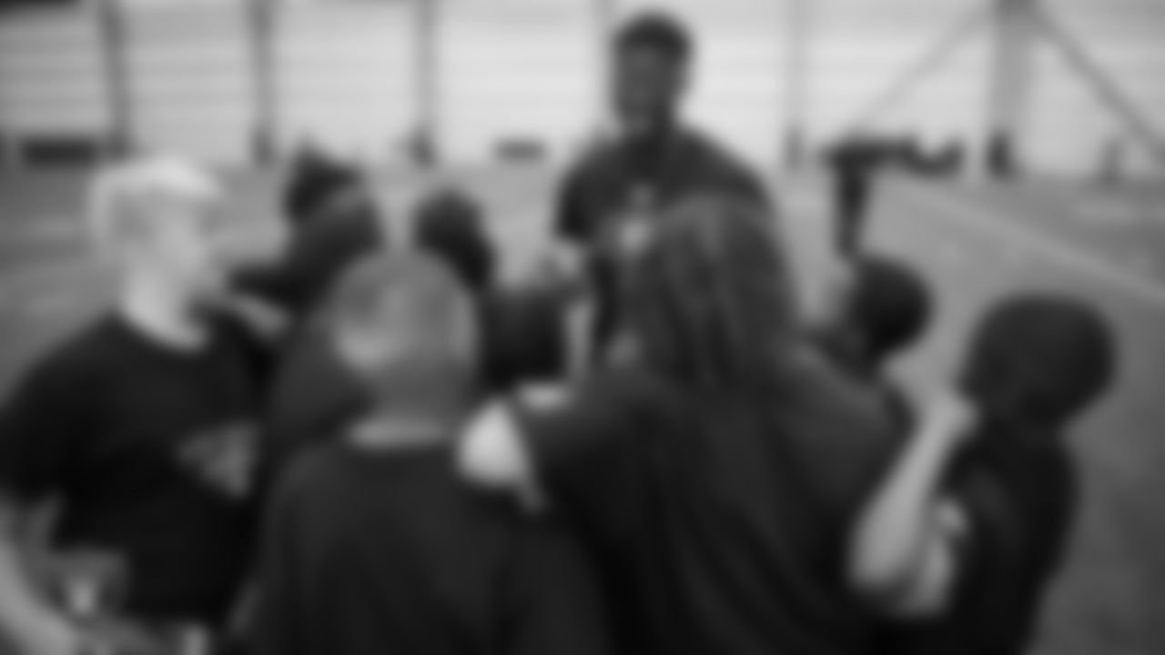 A member of the Grambling State University football team helps on a drill during a Raiders Junior Training Camp at Intermountain Health Performance Center.
