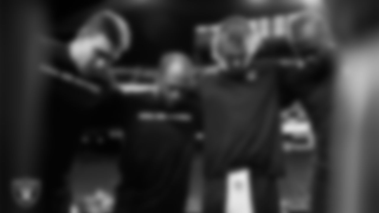 The Las Vegas Raiders wide receivers and quarterbacks huddle before the regular season home game against the Dallas Cowboys at Allegiant Stadium.