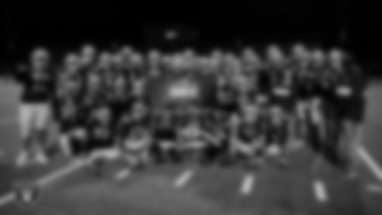 The Foothill High School football poses for a photo after the Las Vegas Raiders' Football Showcase game at Foothill High School.