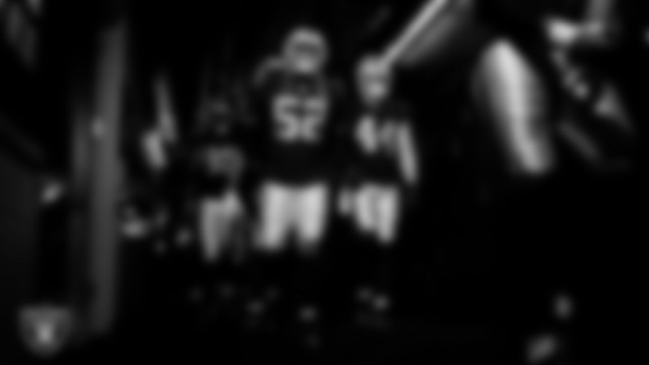 Las Vegas Raiders linebacker Elandon Roberts (52) and linebacker Tommy Eichenberg (44) walk down the tunnel before the regular season home game against the New York Giants at Allegiant Stadium.