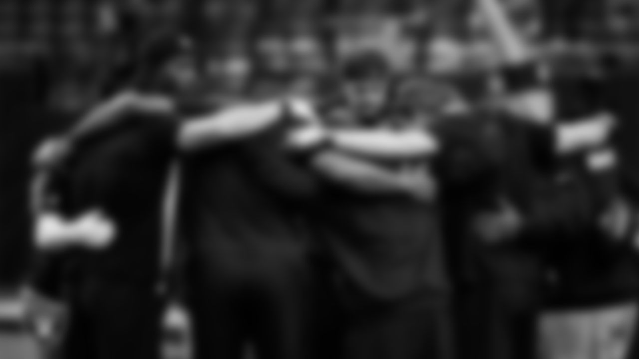 The Las Vegas Raiders wide receivers and quarterbacks huddle before the regular season home game against the Cleveland Browns at Allegiant Stadium.