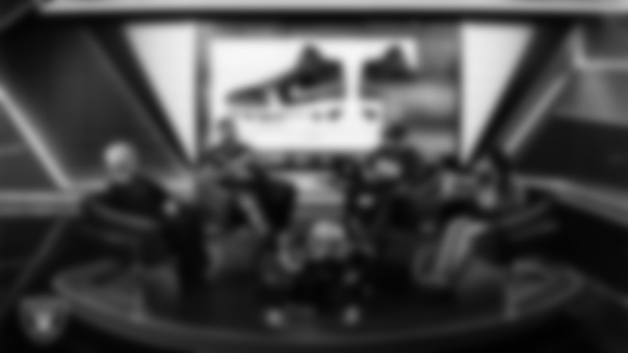 Las Vegas Raiders defensive tackle Jonah Laulu (96) works with representatives from Noah's Animal House Vegas Pet Rescue and designers to design cleats for My Cause My Cleats in Cox Studios at Intermountain Health Performance Center.