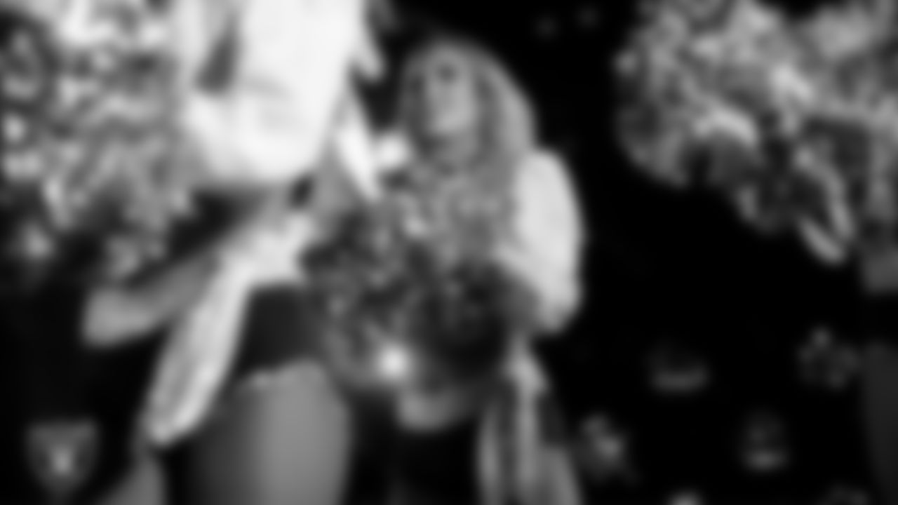 Raiderette Taylor performs with rapper and record producer Lil Jon during halftime at the regular season home game against the Los Angeles Chargers at Allegiant Stadium.