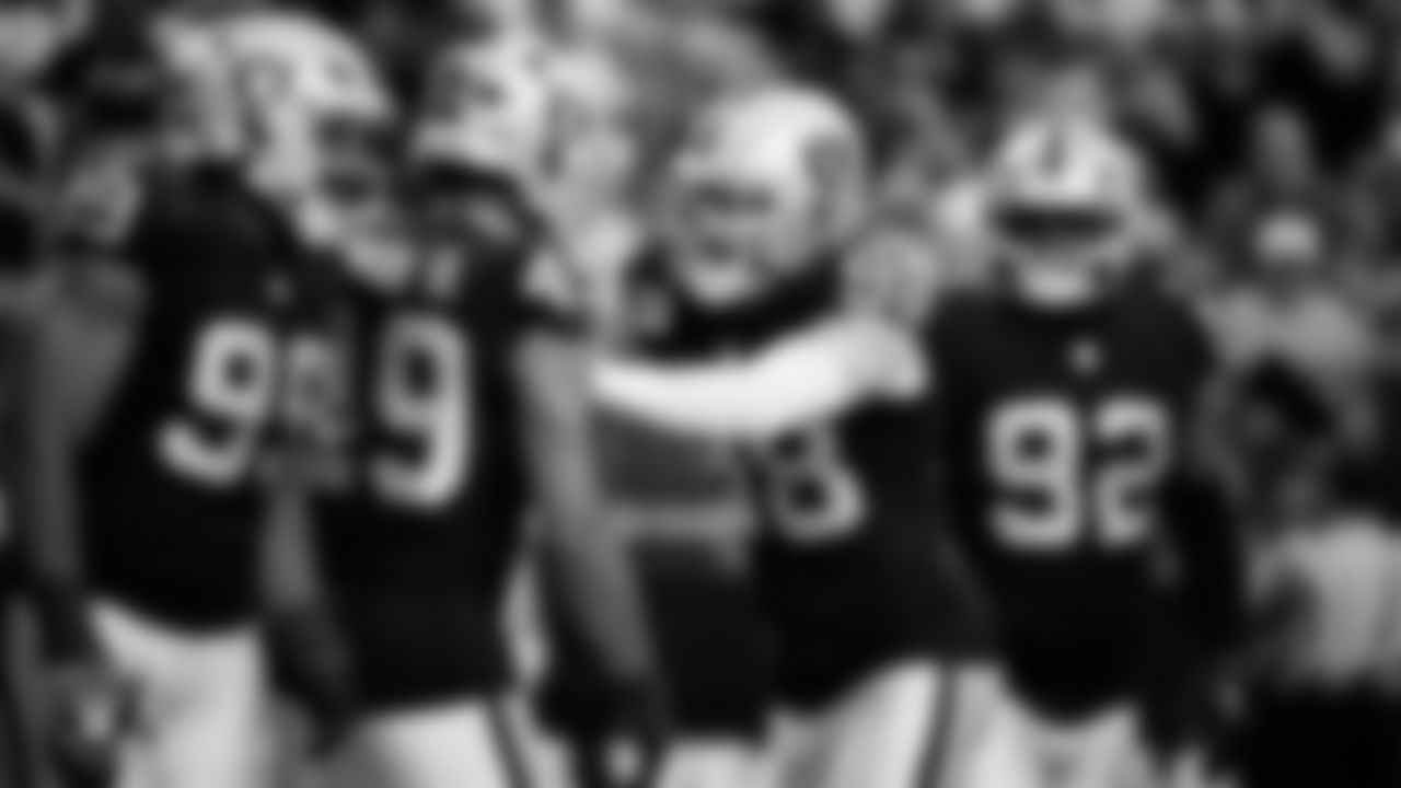 Las Vegas Raiders defensive end Charles Snowden (49) celebrates with defensive end Maxx Crosby (98) after making an interception during the regular season home game against the Cleveland Browns at Allegiant Stadium.