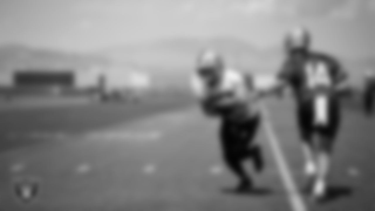 Las Vegas Raiders running back Dylan Laube (23) and quarterback Carter Bradley (14) at an Organized Team Activity (OTA) at Intermountain Health Performance Center.