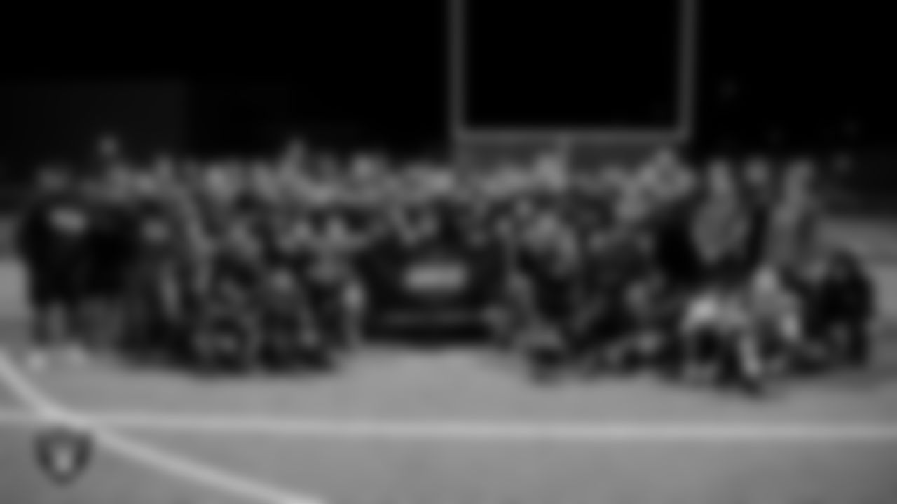 The Coronado High School football team poses for a photo after the Las Vegas Raiders' Football Showcase game at Coronado High School.