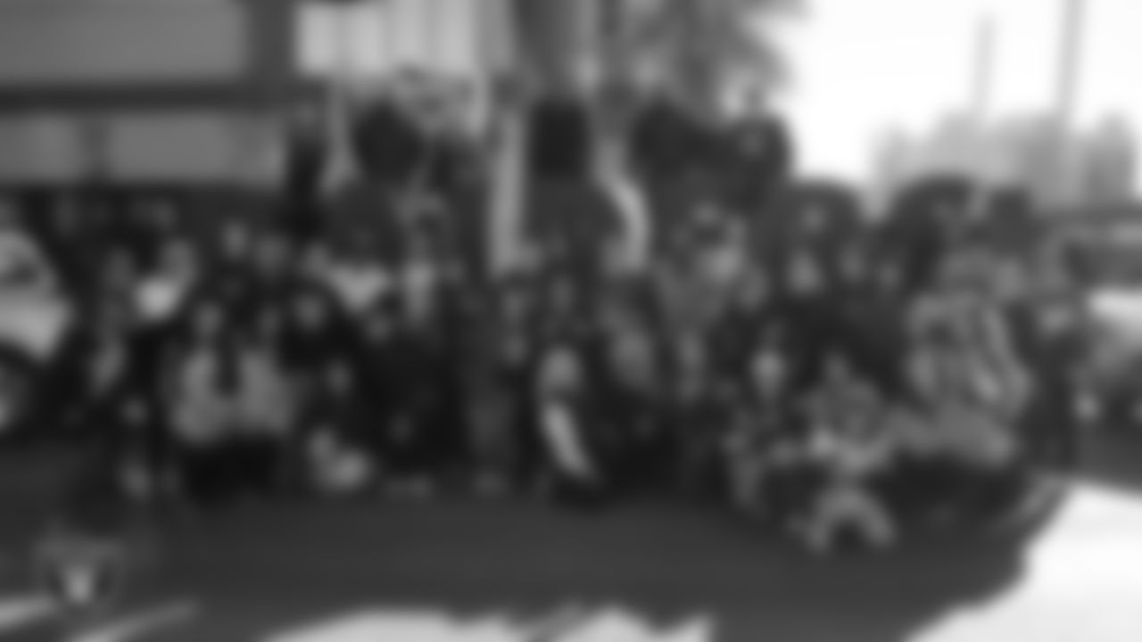 Members of the Las Vegas Raiders organization and their families pose for a photo before the Martin Luther King Jr. Parade in Downtown Las Vegas.