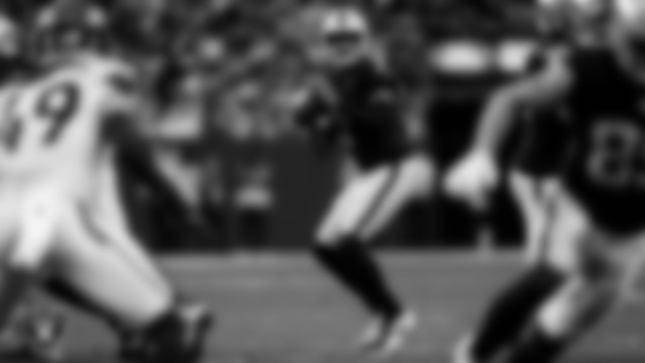 Las Vegas Raiders quarterback Geno Smith (7) looks for a receiver during the regular season home game against the Denver Broncos at Allegiant Stadium.