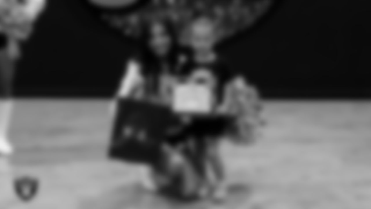 Raiderette Maddie poses for a photo with a Dancer of the Week during day three of summer camp at The Studio.