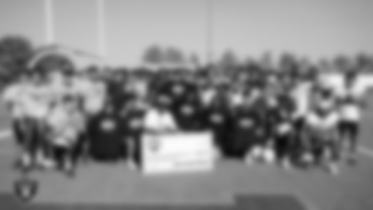 The Cheyenne High School football team poses for a photo during practice at Cheyenne High School.