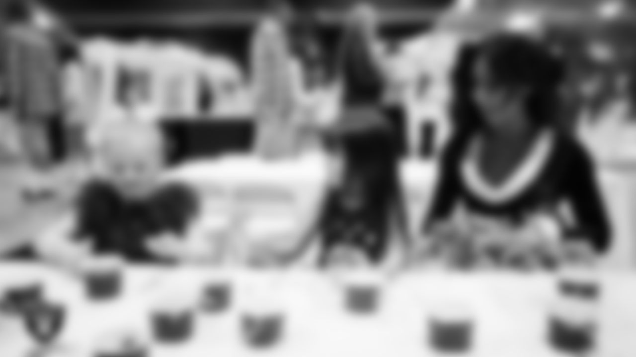 Raiderette Amanda and Junior Raiderettes enjoy activities during the Junior Raiderettes Banquet at The Studio.