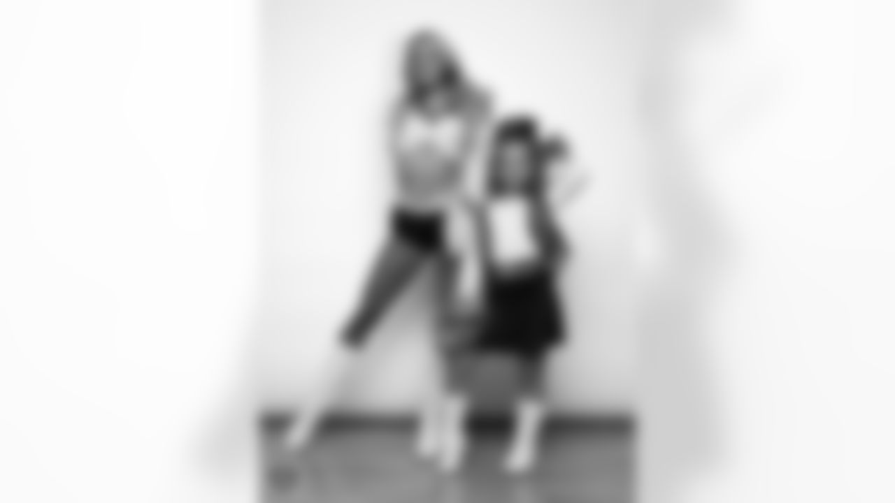 Raiderette Hayley poses for a photo with a Junior Raiderette during 2025 Media Day at The Studio.