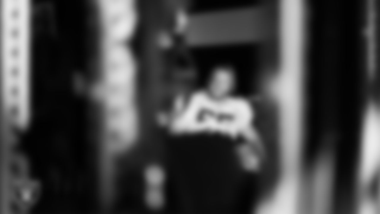 Las Vegas Raiders guard Alex Cappa (65) walks out to the field for practice at Intermountain Health Performance Center.