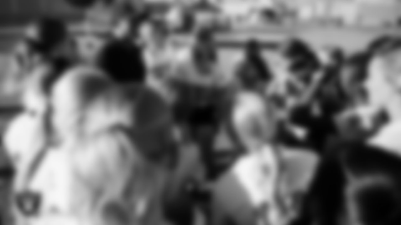 Las Vegas Raiders alumnus Leo Gray talks to the Charles Hughes Middle School after the Las Vegas Raiders' Middle School Flag Football Showcase game at Ralph Cadwallader Middle School.