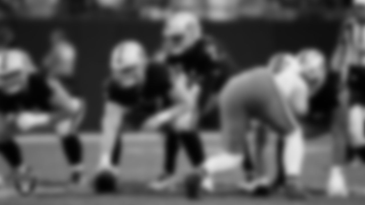 Las Vegas Raiders center Will Putnam (67) and quarterback Geno Smith (7) line up before the snap during the regular season home game against the Cleveland Browns at Allegiant Stadium.