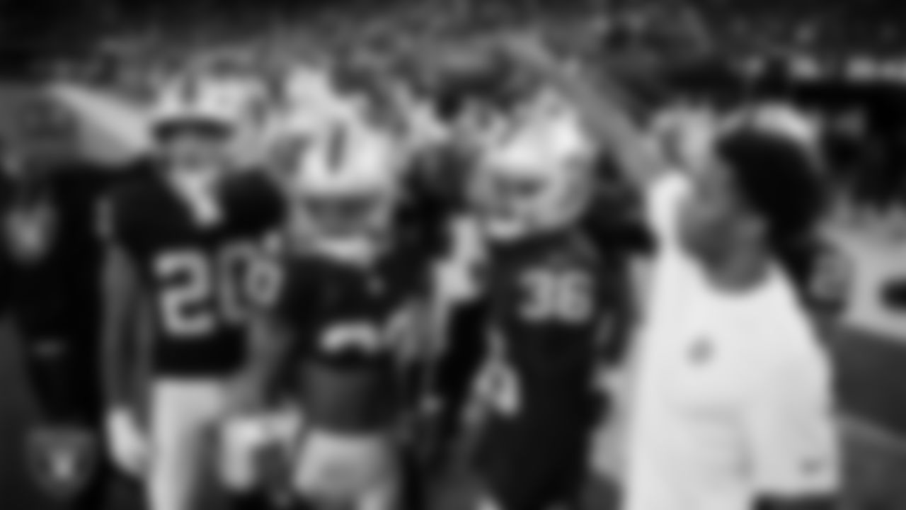 The Las Vegas Raiders defensive backs huddle before the regular season home game against the Los Angeles Chargers at Allegiant Stadium.