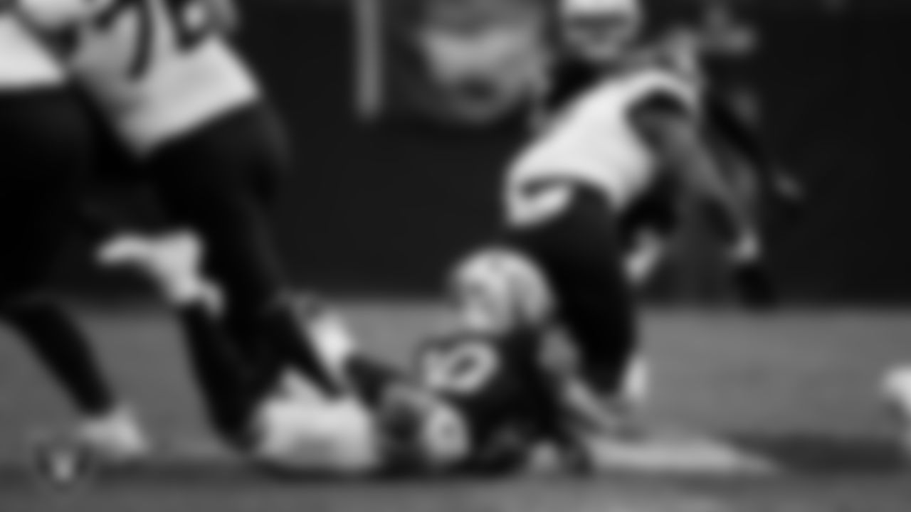 Las Vegas Raiders safety Isaiah Pola-Mao (20) makes a tackle during the regular season home game against the Jacksonville Jaguars at Allegiant Stadium.