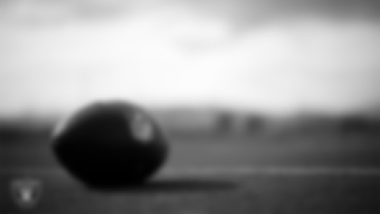 A football on the field during practice at Intermountain Health Performance Center.