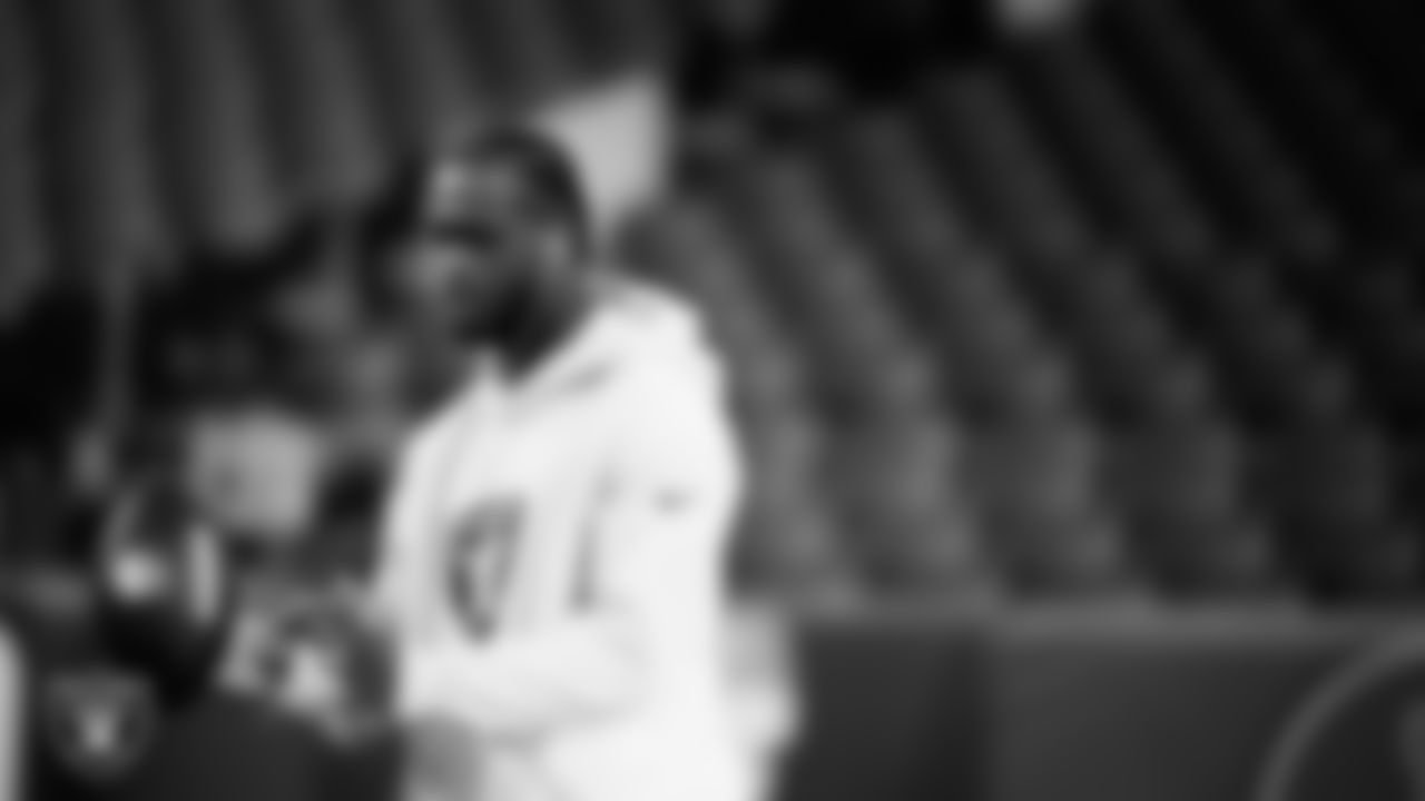 Las Vegas Raiders quarterback Geno Smith (7) warming up before the regular season away game against the Denver Broncos at Empower Field at Mile High.