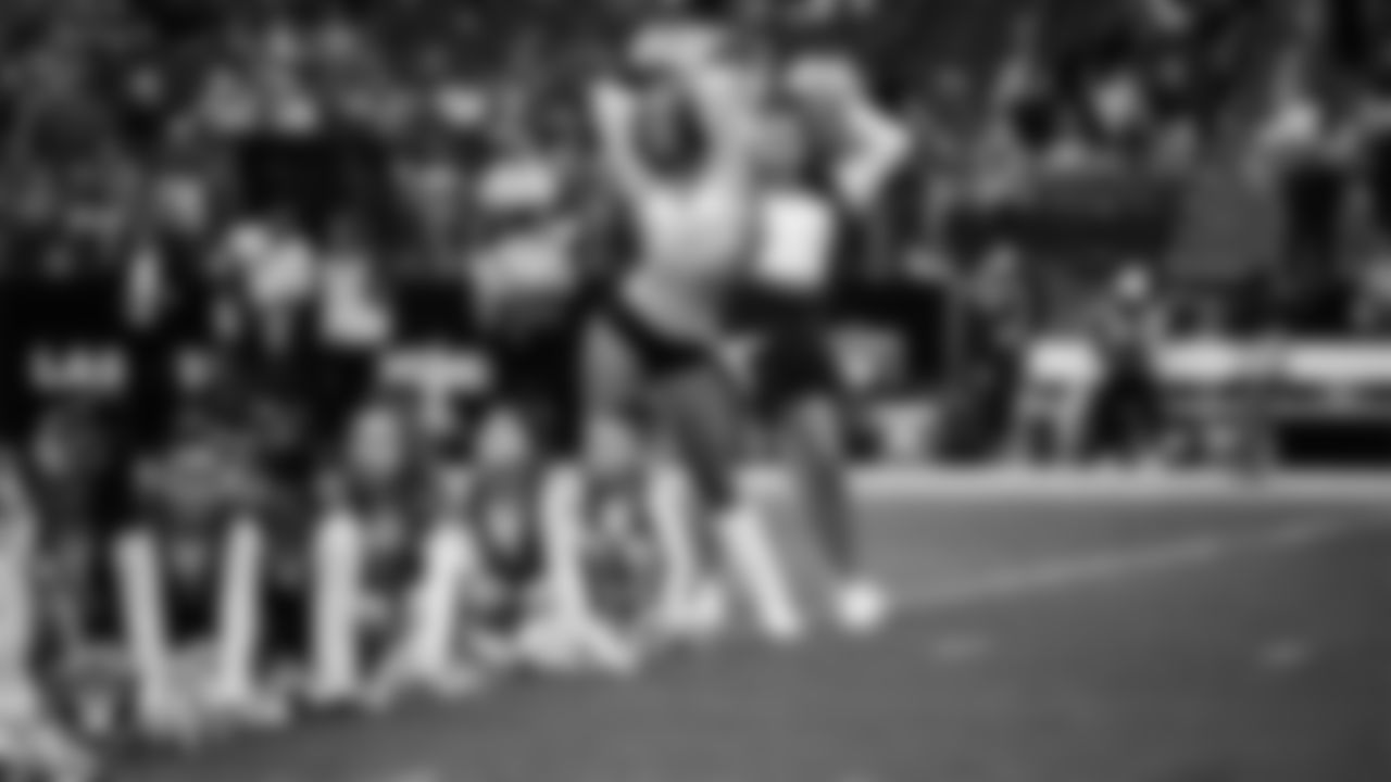 Raiderette Madisyn and Junior Raiderettes perform on the field before the preseason home game against the San Francisco 49ers at Allegiant Stadium.