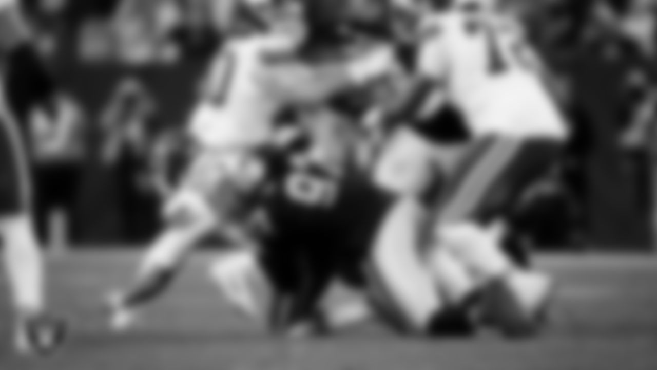 Las Vegas Raiders defensive tackle Tonka Hemingway (97) sacks the quarterback during the regular season home game against the Kansas City Chiefs at Allegiant Stadium.