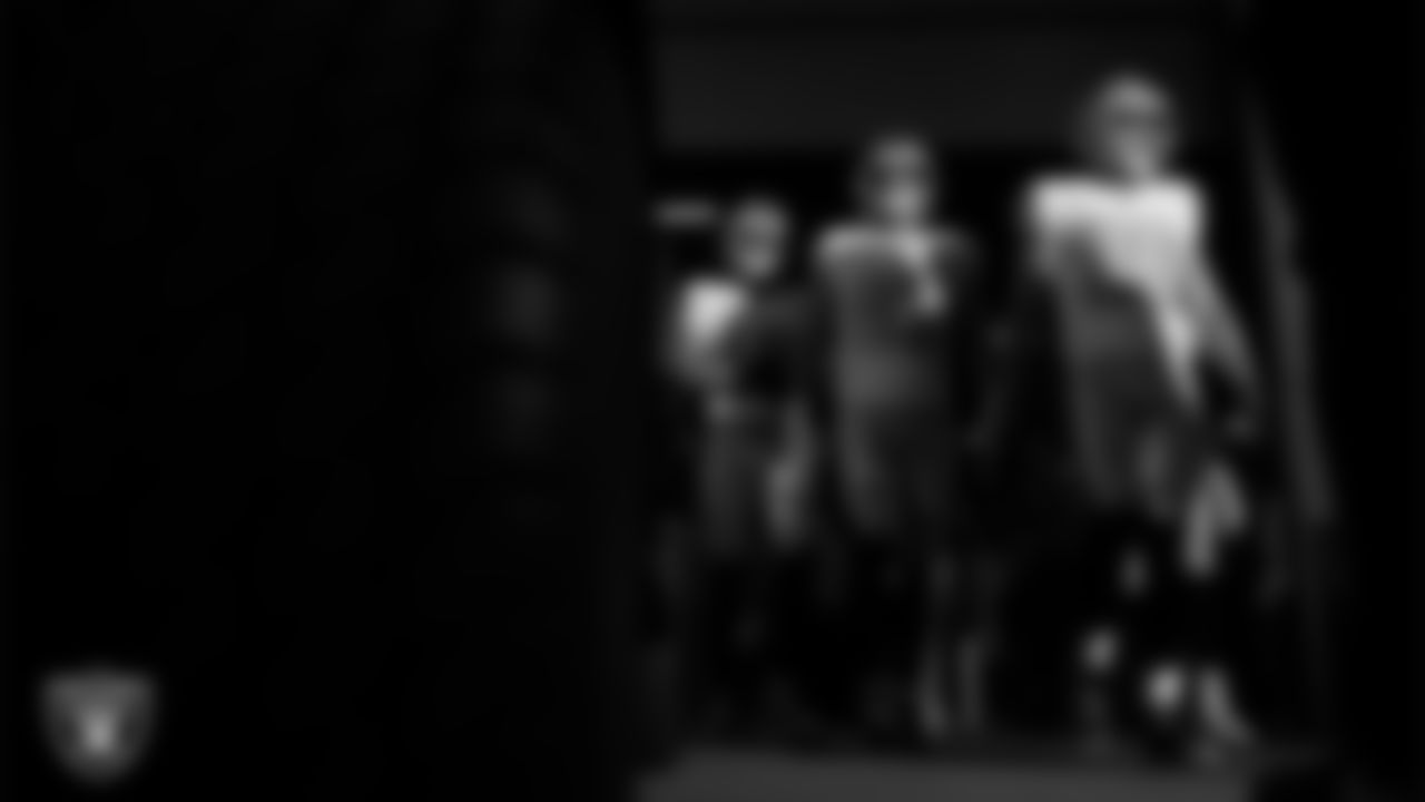 Las Vegas Raiders wide receiver Jack Bech (18), tight end Michael Mayer (87) and tight end Brock Bowers (89) walk down the tunnel before the regular season away game against the Denver Broncos at Empower Field at Mile High.