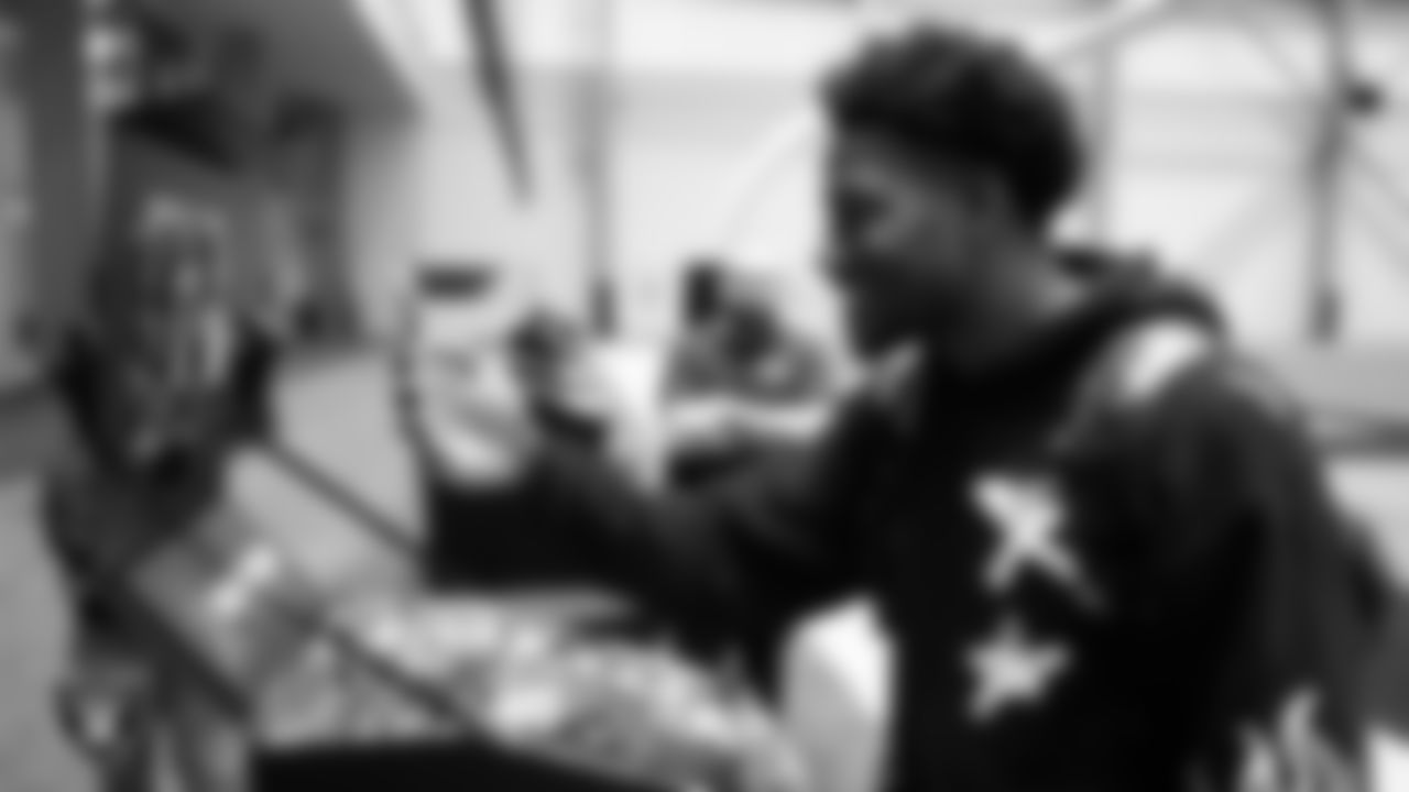 Las Vegas Raiders cornerback Sam Webb (27) unboxes his custom cleats for the NFL's My Cause My Cleats initiative at Intermountain Health Performance Center.