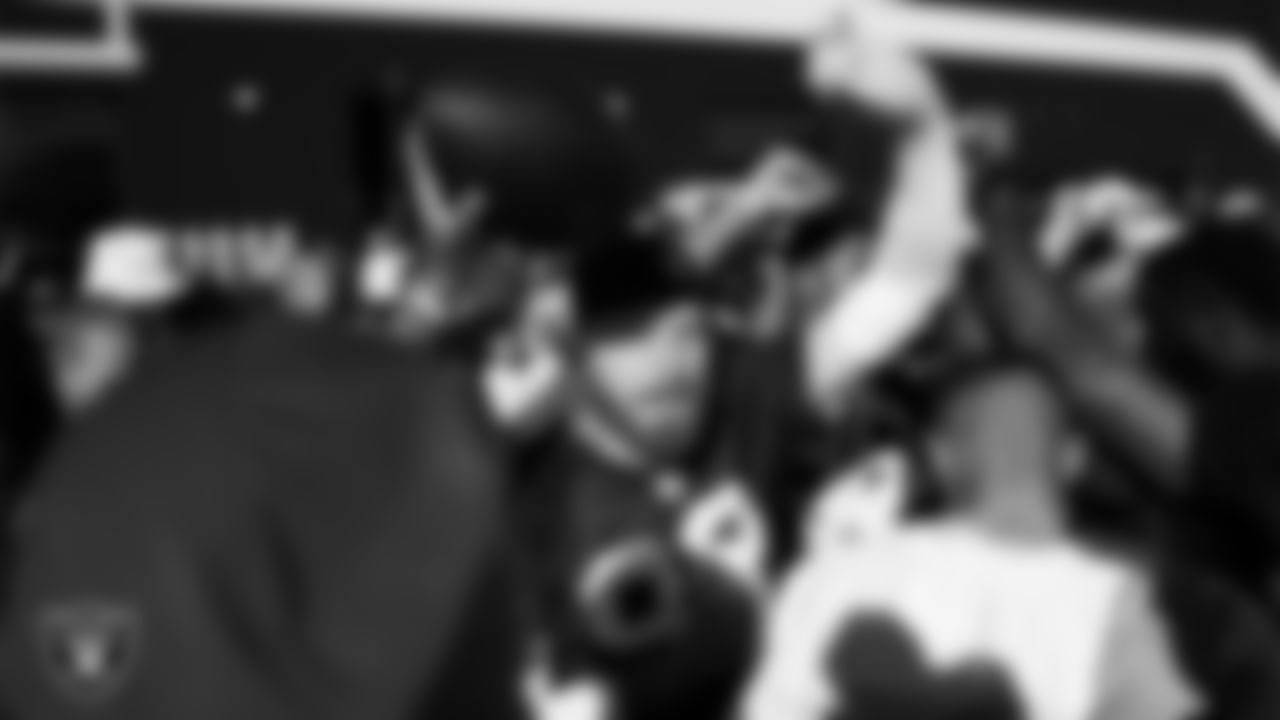 Las Vegas Raiders defensive end Maxx Crosby (98) in a huddle during practice at Intermountain Health Performance Center.