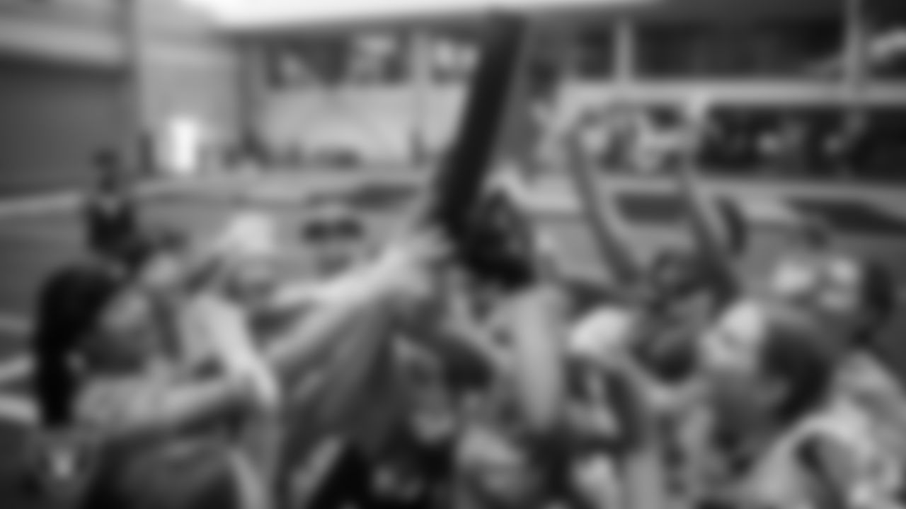 A girls flag football team celebrates after winning the Nike 11-On Flag Football Championship at Intermountain Health Performance Center.