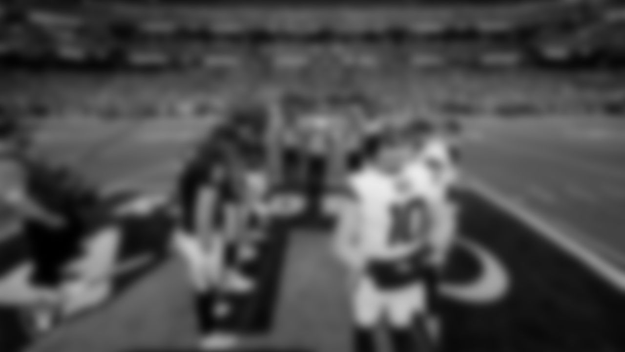 The Las Vegas Raiders during the coin toss before the regular season home game against the Denver Broncos at Allegiant Stadium.