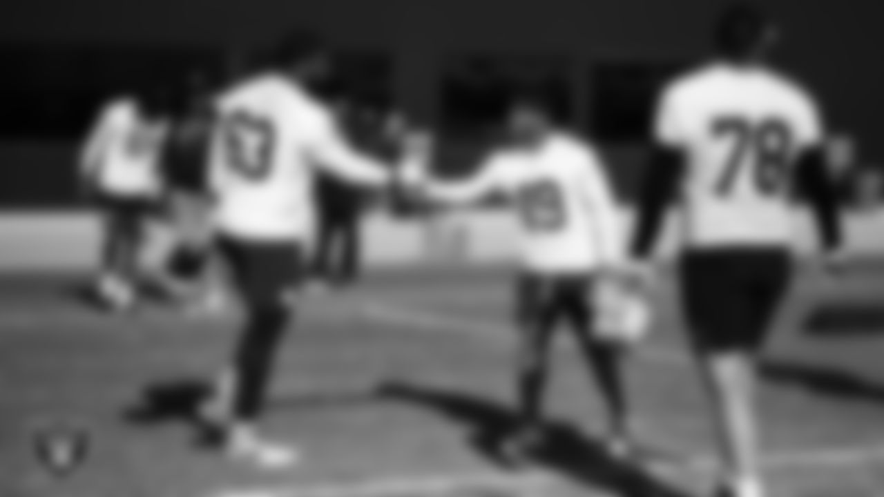 Las Vegas Raiders guard McClendon Curtis (63) and wide receiver DJ Turner (19) during practice at Intermountain Health Performance Center.