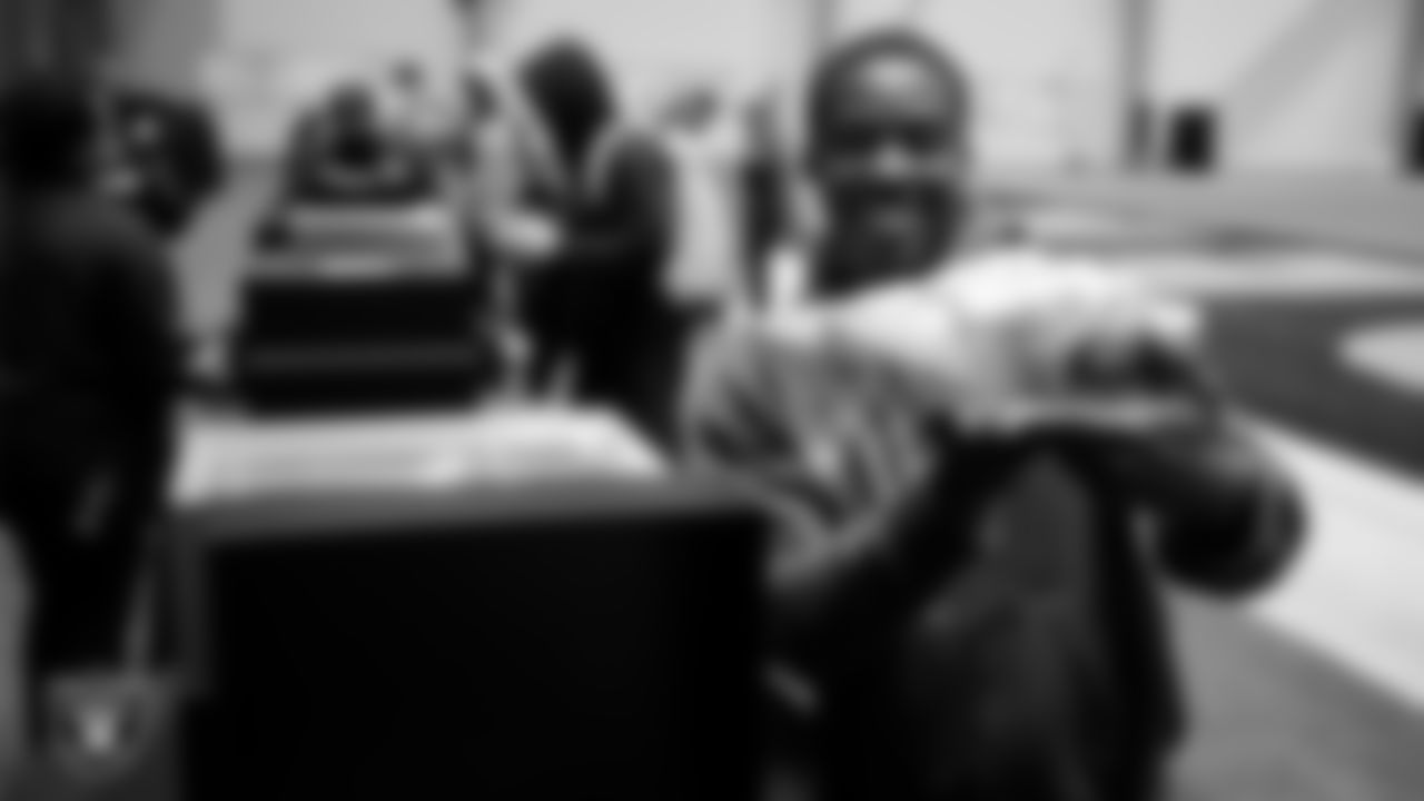 Las Vegas Raiders wide receiver Phillip Dorsett II (13) unboxes his custom cleats for the NFL's My Cause My Cleats initiative at Intermountain Health Performance Center.