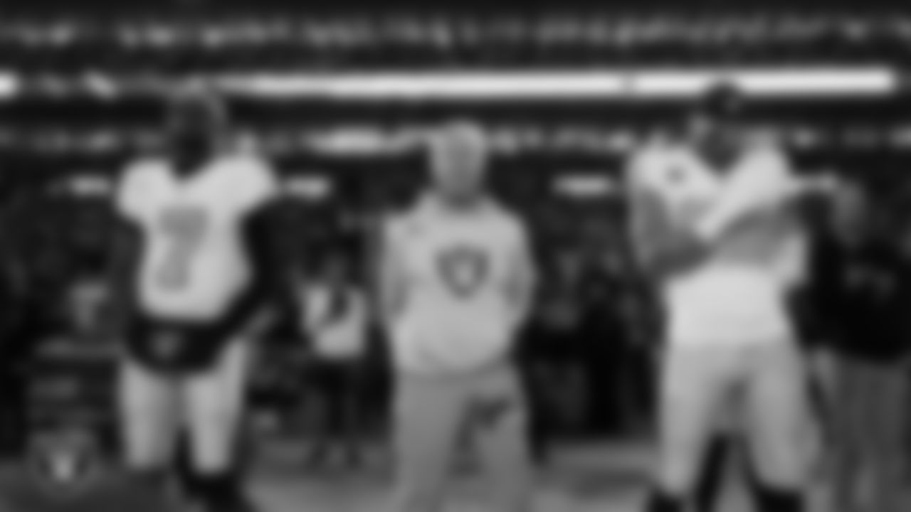 Las Vegas Raiders quarterback Geno Smith (7), Head Coach Pete Carroll and defensive end Maxx Crosby (98) during the national anthem before the regular season away game against the Denver Broncos at Empower Field at Mile High.
