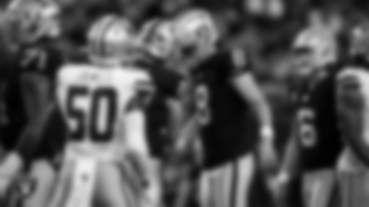 Las Vegas Raiders kicker Daniel Carlson (8) celebrates with tight end Michael Mayer (87) after making a PAT during the regular season home game against the Dallas Cowboys at Allegiant Stadium.