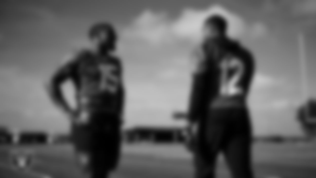 Las Vegas Raiders defensive tackle Thomas Booker IV (99) and defensive end Tyree Wilson (9) during practice at Intermountain Health Performance Center.