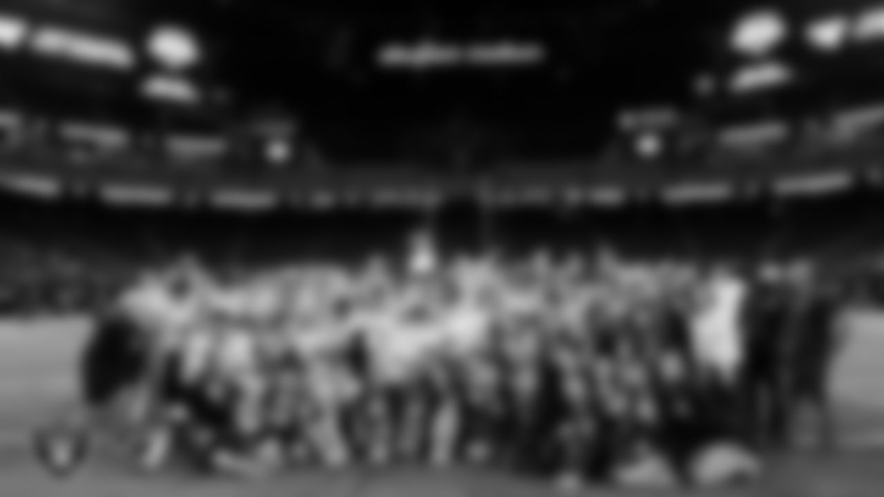 The Spanish Springs High School football and cheer teams pose for a photo after defeating Faith Lutheran High School in the NIAA 5A Division State Championship game at Allegiant Stadium.