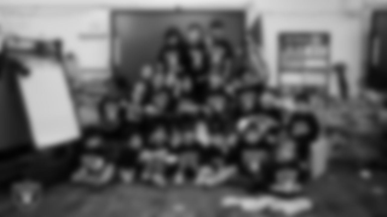 A class celebrates winning the Lil' Raiders School Challenge at Richard H. Bryan Elementary School.