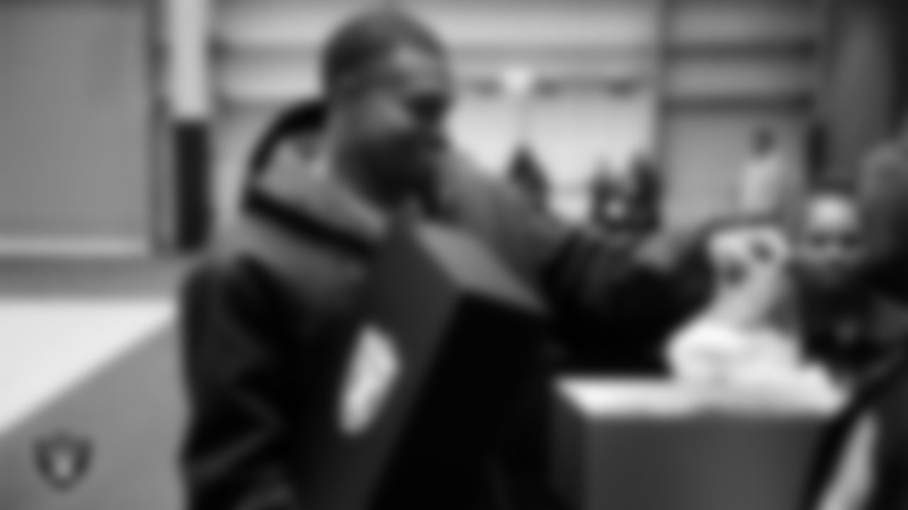 Las Vegas Raiders defensive end Tyree Wilson (9) unboxes his custom cleats for the NFL's My Cause My Cleats initiative at Intermountain Health Performance Center.