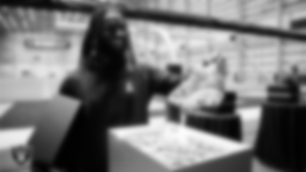 Las Vegas Raiders tight end Ian Thomas (80) unboxes his custom cleats for the NFL's My Cause My Cleats initiative at Intermountain Health Performance Center.