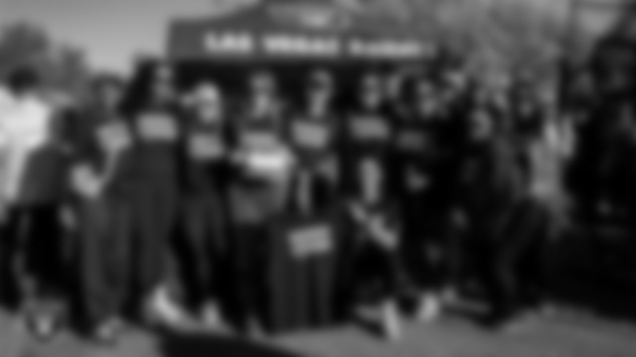 Staff members of the Las Vegas Raiders pose for a photo during the American Cancer Society Making Strides Against Breast Cancer fundraiser at Red Rock Resort.