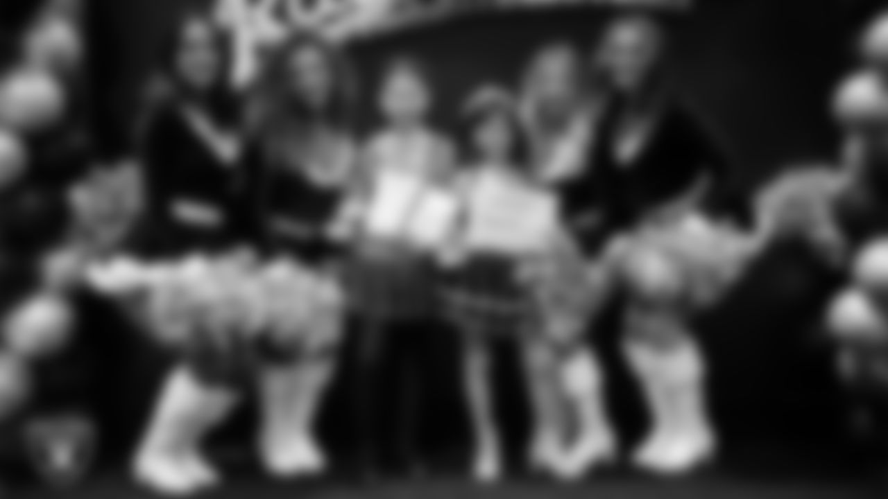 Raiderettes pose for a photo with Junior Raiderettes during the Junior Raiderettes Banquet at The Studio.