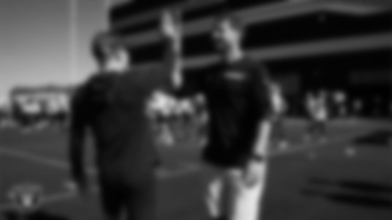 Las Vegas Raiders offensive quality control coach Conner McQueen and offensive assistant Sean Binckes on the field for practice at 2025 Training Camp at Intermountain Health Performance Center.