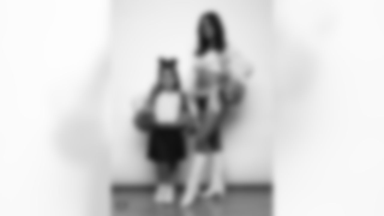 Raiderette Reagan poses for a photo with a Junior Raiderette during 2025 Media Day at The Studio.
